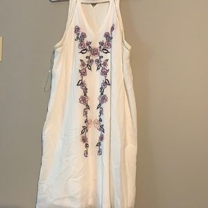 White dress with purple accent, key hole cut